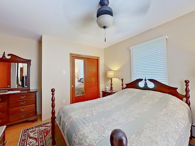 63 N Shore Dr, Owls Head, ME 04854 - bedroom with light wood-style flooring, multiple windows, and a ceiling fan