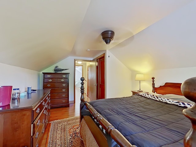 63 N Shore Dr, Owls Head, ME 04854 - bedroom featuring wood finished floors, lofted ceiling, and a ceiling fan