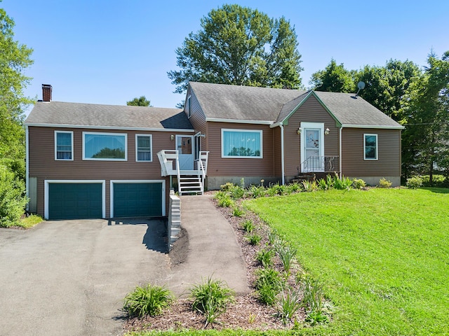63 N Shore Dr, Owls Head, ME 04854 - view of front of home with an attached garage, driveway, a chimney, and a front lawn