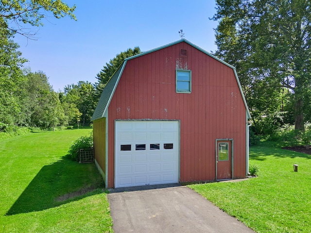 63 N Shore Dr, Owls Head, ME 04854 - detached garage featuring asphalt driveway