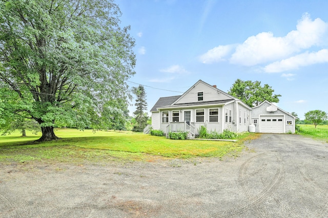 23 W St, Benton, ME 04901 - view of front facade featuring driveway, a front yard, and a chimney