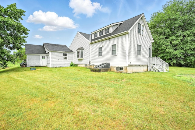 23 W St, Benton, ME 04901 - rear view of property featuring a lawn and a shingled roof