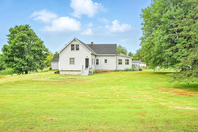 23 W St, Benton, ME 04901 - rear view of house with a chimney, a yard, and a shingled roof