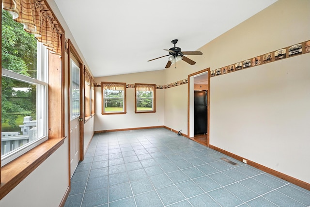 23 W St, Benton, ME 04901 - unfurnished room featuring lofted ceiling, ceiling fan, and dark tile patterned floors