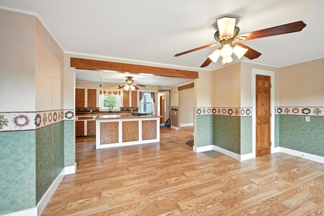 23 W St, Benton, ME 04901 - kitchen featuring light wood-type flooring, a ceiling fan, ornamental molding, and a wainscoted wall