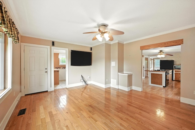 23 W St, Benton, ME 04901 - unfurnished living room with ceiling fan, light wood-type flooring, and crown molding