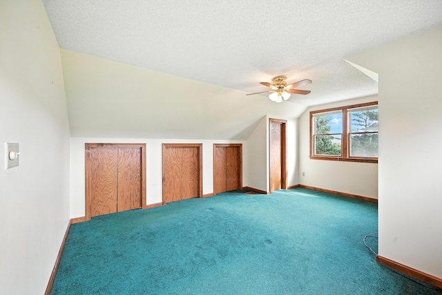 23 W St, Benton, ME 04901 - bonus room with ceiling fan, vaulted ceiling, carpet flooring, and a textured ceiling