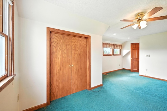 23 W St, Benton, ME 04901 - unfurnished bedroom with carpet flooring, a closet, and ceiling fan