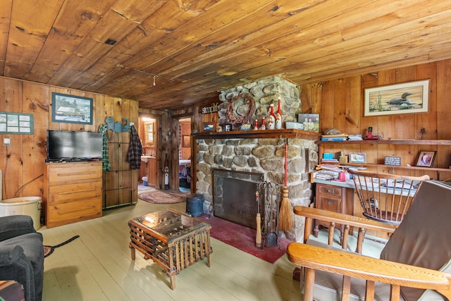 199 Peace Pipe Dr, Litchfield, ME 04350 - living room featuring wood walls, wood ceiling, wood-type flooring, and a fireplace