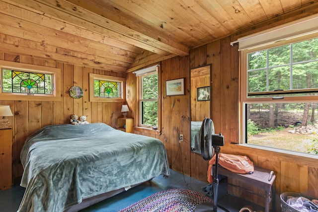199 Peace Pipe Dr, Litchfield, ME 04350 - bedroom featuring multiple windows, wooden ceiling, wood walls, and vaulted ceiling