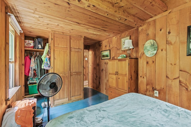 199 Peace Pipe Dr, Litchfield, ME 04350 - bedroom featuring wooden ceiling, wood walls, wood finished floors, and a closet