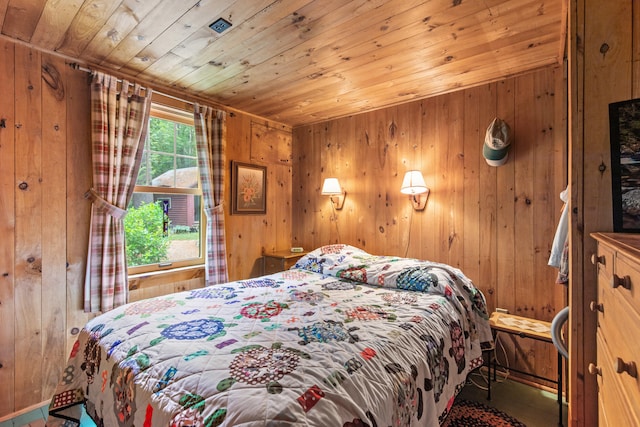 199 Peace Pipe Dr, Litchfield, ME 04350 - bedroom featuring wooden ceiling and wooden walls