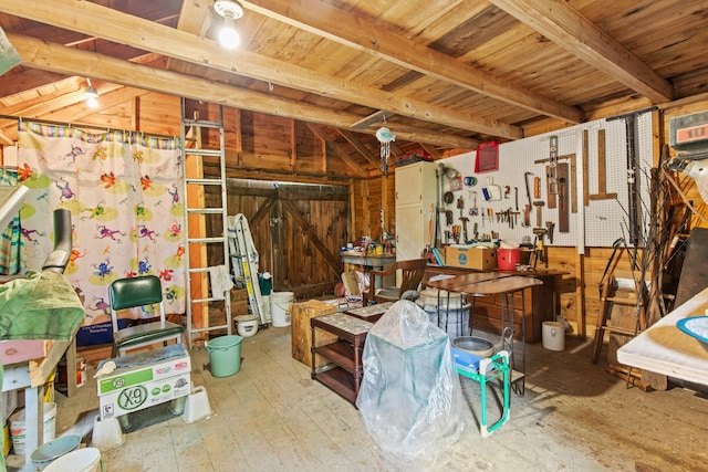 199 Peace Pipe Dr, Litchfield, ME 04350 - miscellaneous room with a wooden ceiling with exposed beams, a workshop area, hardwood / wood-style flooring, and wooden walls