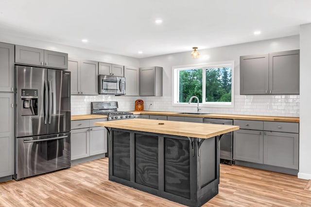 985 Main Rd, Eddington, ME 04428 - kitchen featuring butcher block counters, appliances with stainless steel finishes, gray cabinetry, and recessed lighting