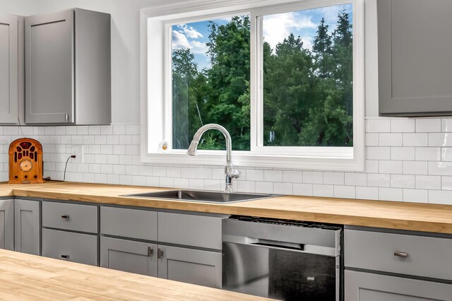 985 Main Rd, Eddington, ME 04428 - kitchen with wood counters, dishwasher, and gray cabinetry