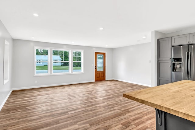 985 Main Rd, Eddington, ME 04428 - unfurnished living room featuring plenty of natural light, light wood-style flooring, and recessed lighting
