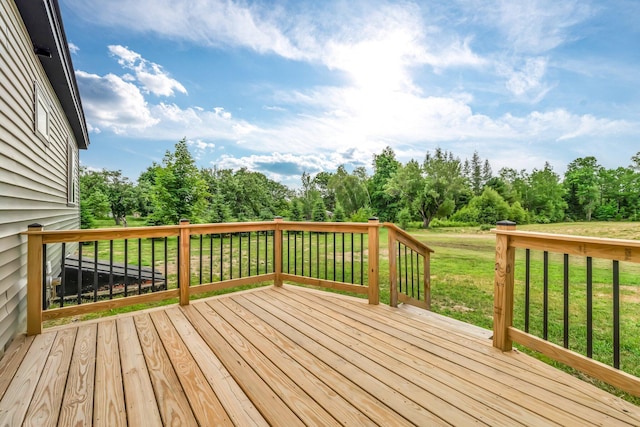 985 Main Rd, Eddington, ME 04428 - deck featuring a yard and view of wooded area