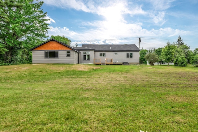 985 Main Rd, Eddington, ME 04428 - back of property featuring a yard and a deck