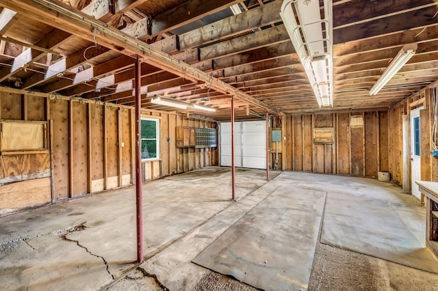 985 Main Rd, Eddington, ME 04428 - misc room featuring a garage, healthy amount of natural light, and concrete flooring
