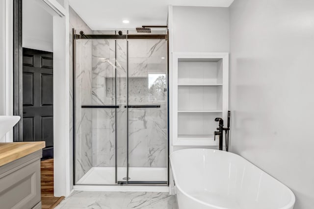 985 Main Rd, Eddington, ME 04428 - bathroom featuring marble finish floors, a marble finish shower, a soaking tub, and vanity