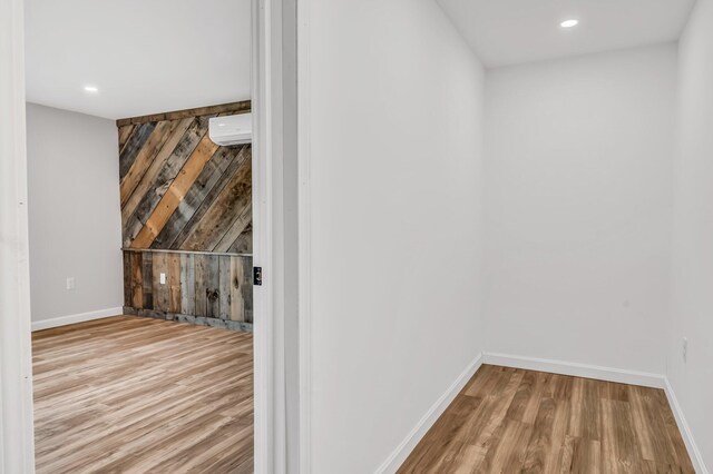 985 Main Rd, Eddington, ME 04428 - hall featuring a wall mounted AC, wood finished floors, and recessed lighting