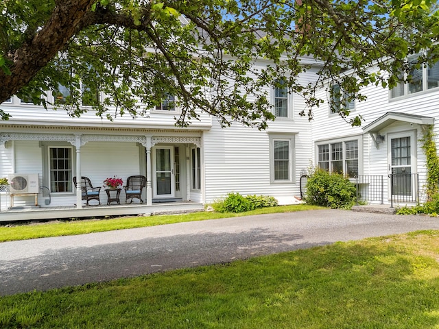 50-52 Mechanic St, Rockland, ME 04841 - rear view of property with covered porch and a yard