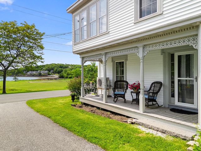 50-52 Mechanic St, Rockland, ME 04841 - covered porch featuring a water view and a lawn