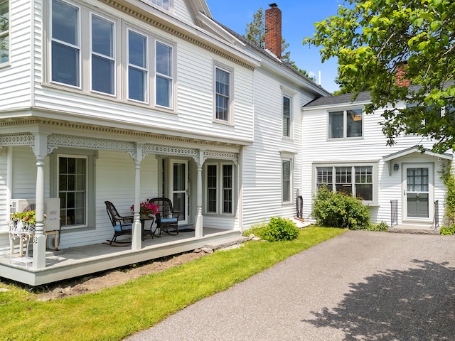 50-52 Mechanic St, Rockland, ME 04841 - back of property featuring covered porch and a chimney