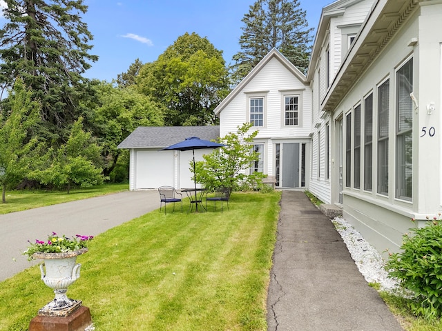 50-52 Mechanic St, Rockland, ME 04841 - view of grassy yard featuring an attached garage