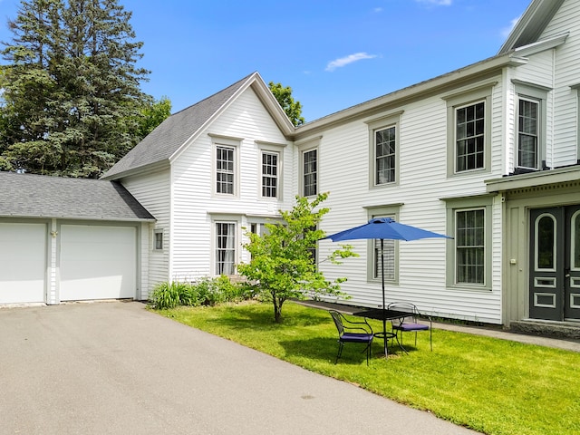 50-52 Mechanic St, Rockland, ME 04841 - view of front of house featuring a front yard, an attached garage, and driveway