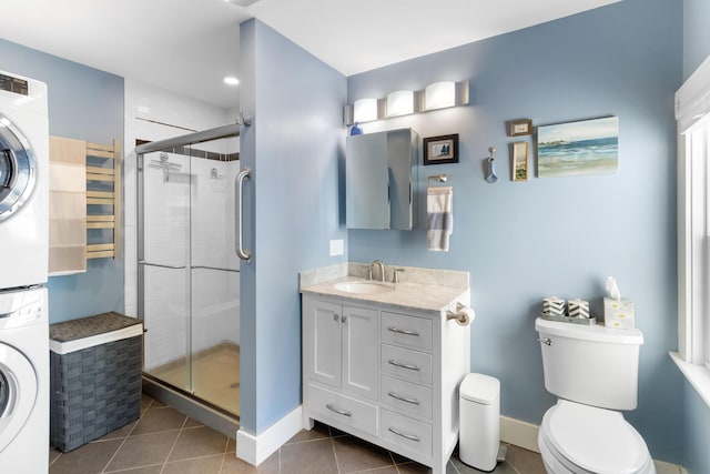 50-52 Mechanic St, Rockland, ME 04841 - bathroom with stacked washer / dryer, a shower stall, tile patterned flooring, and vanity