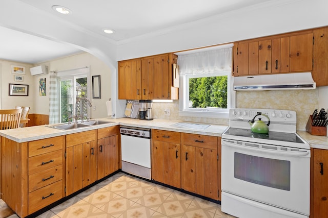 50-52 Mechanic St, Rockland, ME 04841 - kitchen featuring white appliances, under cabinet range hood, a peninsula, plenty of natural light, and recessed lighting