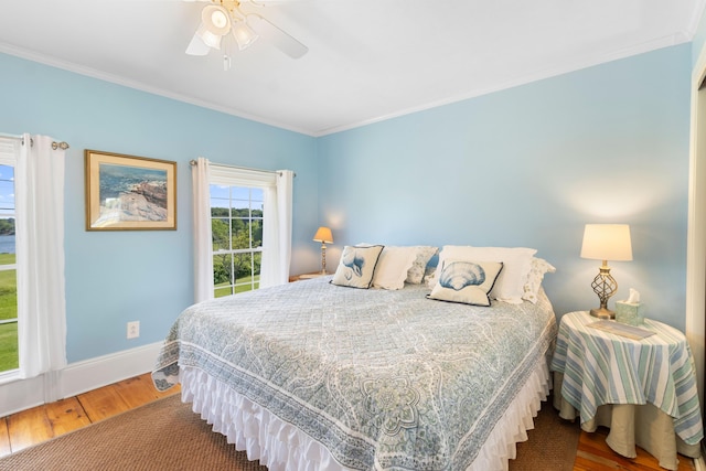 50-52 Mechanic St, Rockland, ME 04841 - bedroom with wood finished floors, crown molding, and ceiling fan