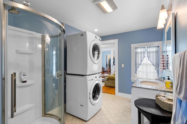 50-52 Mechanic St, Rockland, ME 04841 - laundry area with stacked washer / drying machine and baseboards