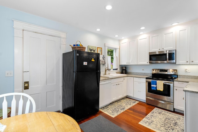 50-52 Mechanic St, Rockland, ME 04841 - kitchen with appliances with stainless steel finishes, dark wood-style floors, white cabinets, and recessed lighting