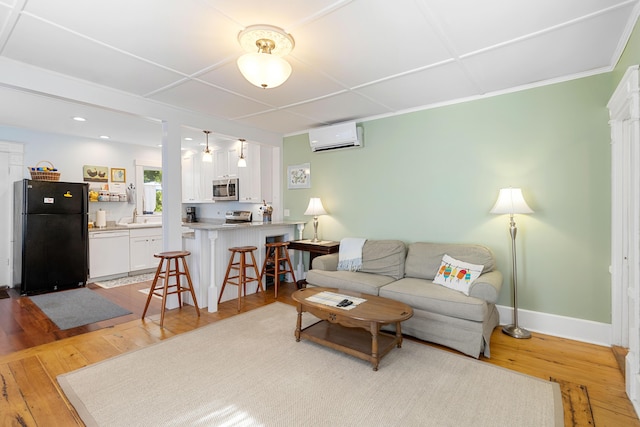 50-52 Mechanic St, Rockland, ME 04841 - living area with a wall mounted AC, light wood-style floors, and recessed lighting