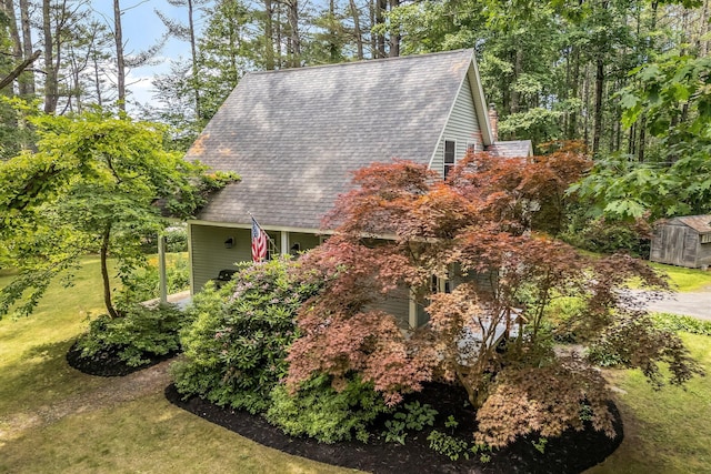 2 Falling Pines Ln, Readfield, ME 04355 - view of side of property with roof with shingles and a yard