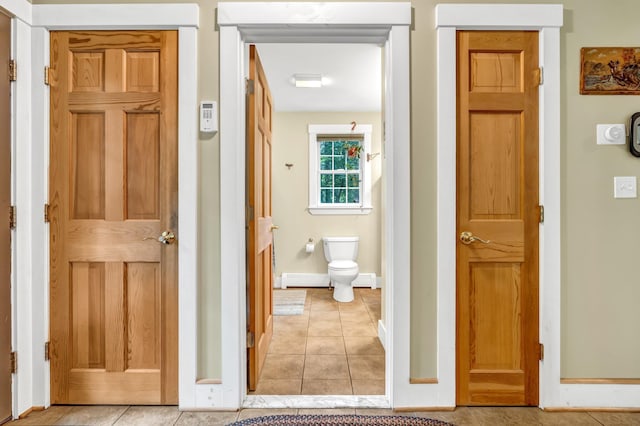 2 Falling Pines Ln, Readfield, ME 04355 - hallway featuring light tile patterned floors and a baseboard radiator