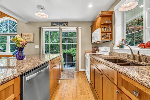 2 Falling Pines Ln, Readfield, ME 04355 - kitchen featuring white appliances, brown cabinetry, light wood finished floors, open shelves, and decorative light fixtures
