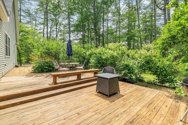 2 Falling Pines Ln, Readfield, ME 04355 - deck featuring outdoor dining space and view of wooded area