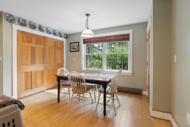 2 Falling Pines Ln, Readfield, ME 04355 - dining room with light wood finished floors and a baseboard heating unit