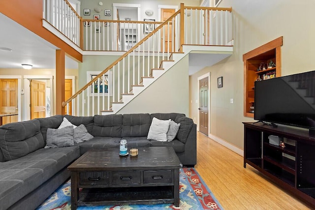 2 Falling Pines Ln, Readfield, ME 04355 - living area featuring stairs, a towering ceiling, and wood finished floors