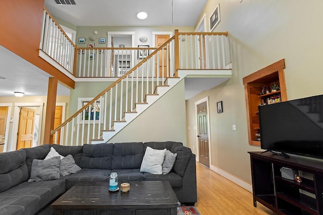 2 Falling Pines Ln, Readfield, ME 04355 - living room with stairs, wood finished floors, and a high ceiling