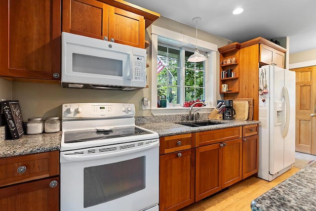 2 Falling Pines Ln, Readfield, ME 04355 - kitchen featuring white appliances, brown cabinetry, and dark stone countertops