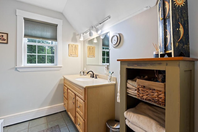 2 Falling Pines Ln, Readfield, ME 04355 - bathroom with a baseboard radiator, tile patterned floors, vaulted ceiling, and vanity