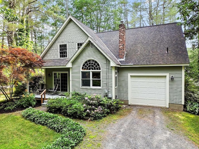 2 Falling Pines Ln, Readfield, ME 04355 - view of front of property featuring dirt driveway, a chimney, and a garage