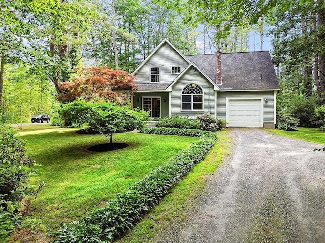 2 Falling Pines Ln, Readfield, ME 04355 - traditional home with driveway, a front lawn, a garage, and a chimney