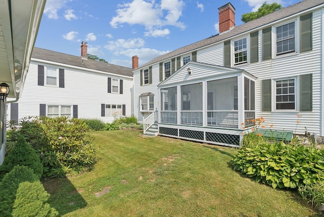 26 Grove St, Bath, ME 04530 - back of property with a sunroom, a chimney, and a yard