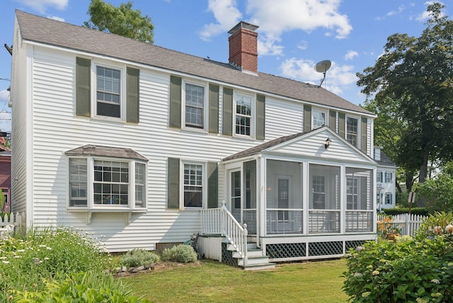 26 Grove St, Bath, ME 04530 - rear view of house featuring a chimney, a sunroom, and roof with shingles