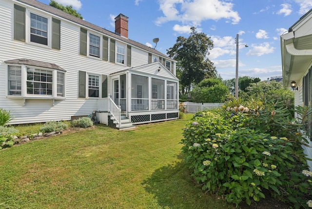 26 Grove St, Bath, ME 04530 - back of property with a sunroom and a chimney